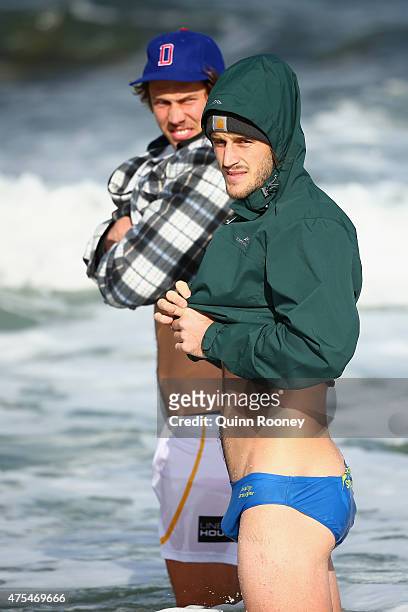 Tom Hickey and Josh Bruce of the Saints wade in the water during a St Kilda Saints recovery session at Brighton Beach on June 1, 2015 in Melbourne,...