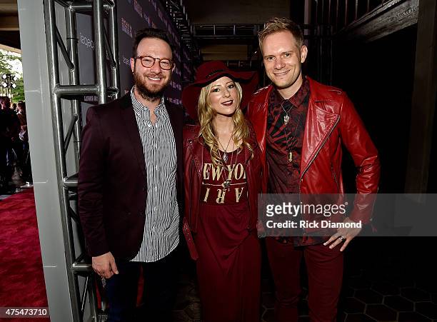 Musician Chris August, poses with Jodi King and Chris Rademaker of musical group Love & The Outcome during the 3rd Annual KLOVE Fan Awards at the...