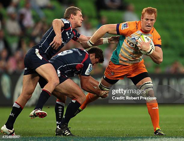 Philip van der Walt of the Cheetahs is tackled during the round three Super Rugby match between the Melbourne Rebels and the Cheetahs at AAMI Park on...