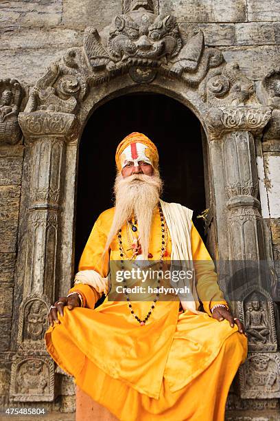 sadhu - indian holyman sitting in the temple - sadhu stock pictures, royalty-free photos & images