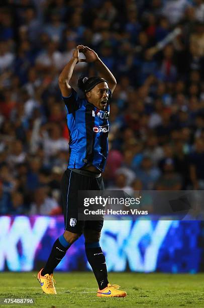 Ronaldinho of Queretaro encourages fans during a championship second leg match between Queretaro and Santos Laguna as part of Clausura 2015 Liga MX...