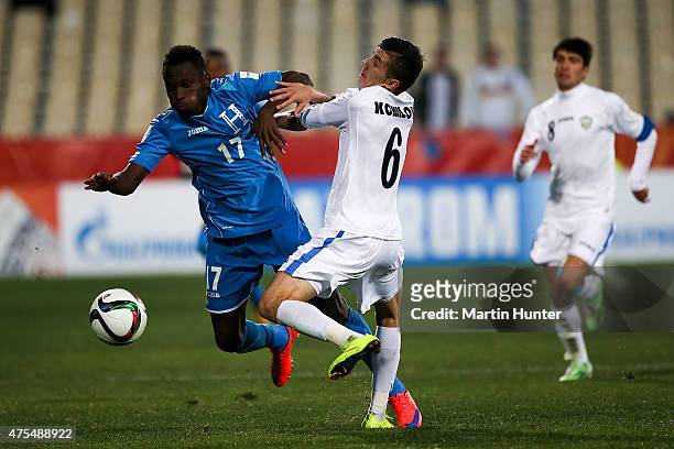 Alberth Elis of Honduras battles with Akramjon Komilov of Uzbekistan during the Group E Group E FIFA U-20 World Cup New Zealand 2015 match between...