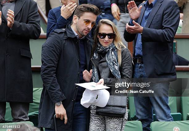 Audrey Lamy and her boyfriend Thomas Sabatier attend day 8 of the French Open 2015 at Roland Garros stadium on May 31, 2015 in Paris, France.