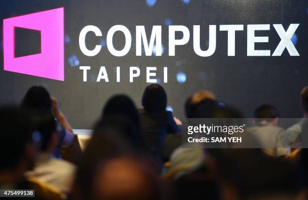 Journalists attend a press conference ahead of the Computex tech trade show at the World Trade Center in Taipei on June 1, 2015. Smart living and...
