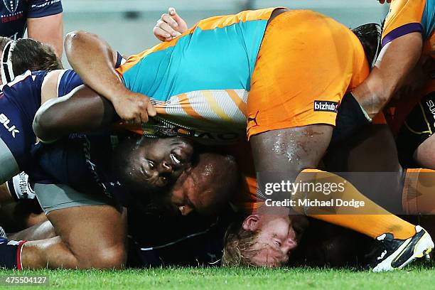 Adriaan Strauss of the Cheetahs has his head pinned to the ground in a scrum during the round three Super Rugby match between the Melbourne Rebels...