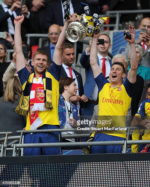 Per Metesacker and Laurent Koscielny celebrates after the FA Cup Final between Aston Villa and Arsenal at Wembley Stadium on May 30, 2015 in London,...