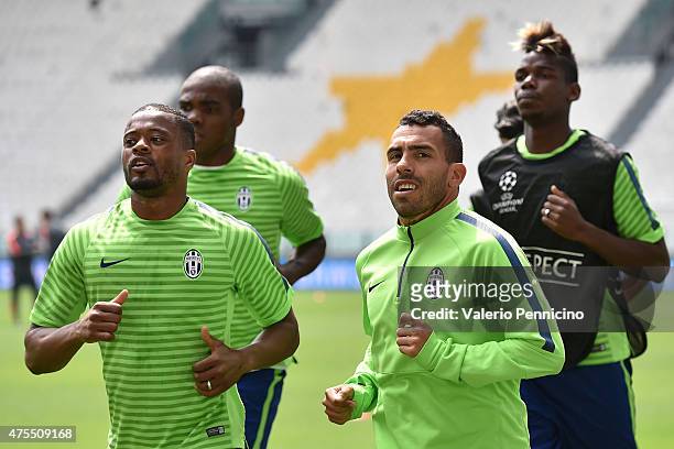 Carlos Tevez and Patrice Evra of Juventus FC in action during the Juventus Media Day at Juventus Arena on June 1, 2015 in Turin, Italy.