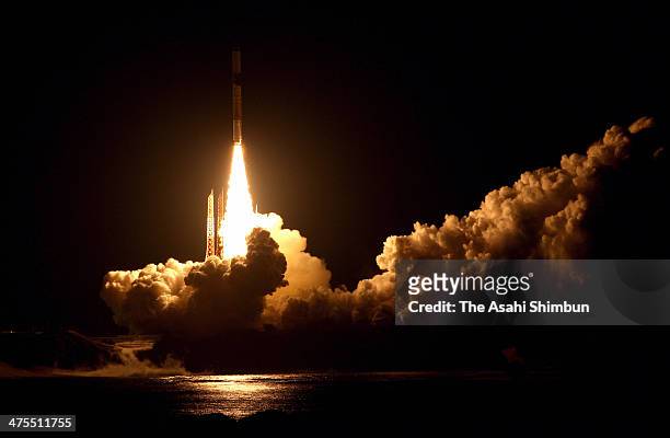 The H-2A Launch Vehicle No. 23 carrying the Global Precipitation Measurement core observatory onboard lifts off from the Japan Aerospace Exploration...