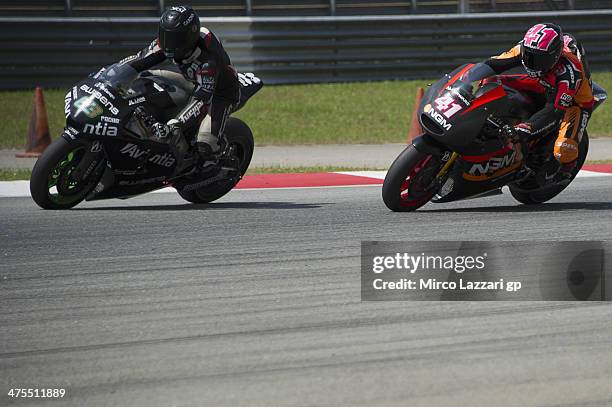 Mike Di Meglio of France and Avintia Blusens leads Aleix Espargaro of Spain and NGM Mobile Forward Racing during the MotoGP Tests in Sepang - Day...