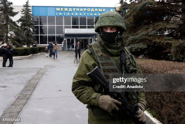 The gunmen wearing similar military uniforms without markings captured the airport in the capital of Ukraine's Crimea region, Simferopol on February...