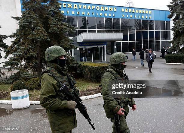 The gunmen wearing similar military uniforms without markings captured the airport in the capital of Ukraine's Crimea region, Simferopol on February...