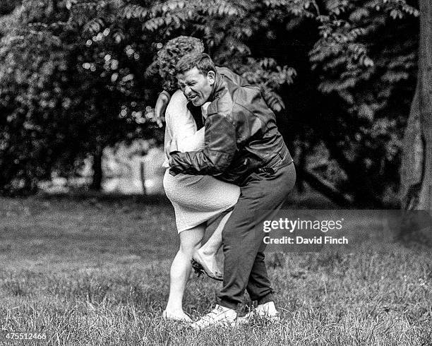 British Judo coach, Roy Inman who was later awarded an OBE, suffers an agonising attack by judo World champion Ann Hughes during a photo shoot for...