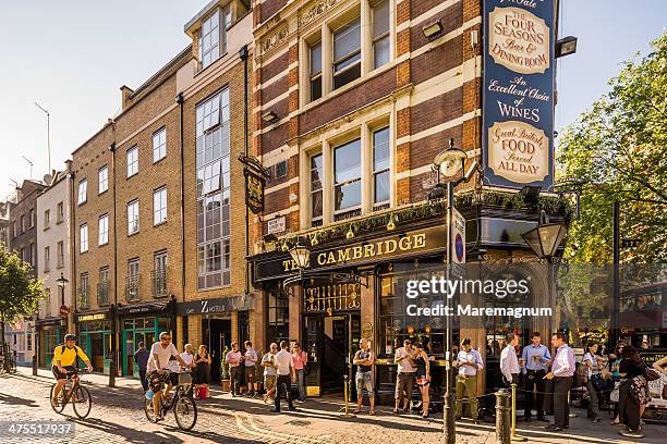 soho, people near a pub - london pub stock pictures, royalty-free photos & images