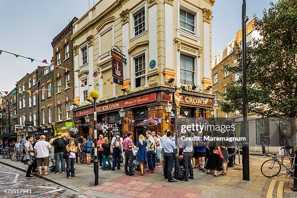 soho, people near a pub - london pub stock pictures, royalty-free photos & images