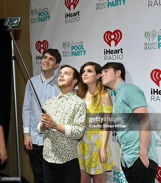 Bassist Noah Sierota, guitarist Jamie Sierota, singer Sydney Sierota and drummer Graham Sierota of Echosmith take a selfie during The iHeartRadio...