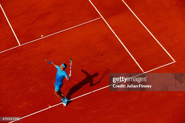 Rafael Nadal of Spain serves in his Men's Singles match against Jack Sock of the United States on day nine of the 2015 French Open at Roland Garros...