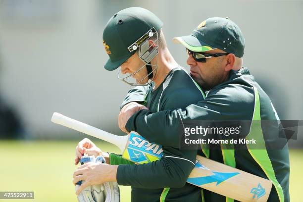 Darren Lehmann of Australia speaks to Michael Clarke during an Australian nets session at Newlands Stadium on February 28, 2014 in Cape Town, South...