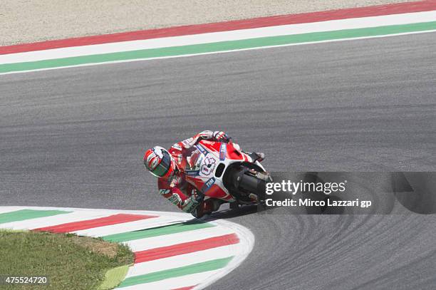 Andrea Dovizioso of Italy and Ducati Team heads rounds the bend during the Michelin tires test during the MotoGp Tests At Mugello at Mugello Circuit...