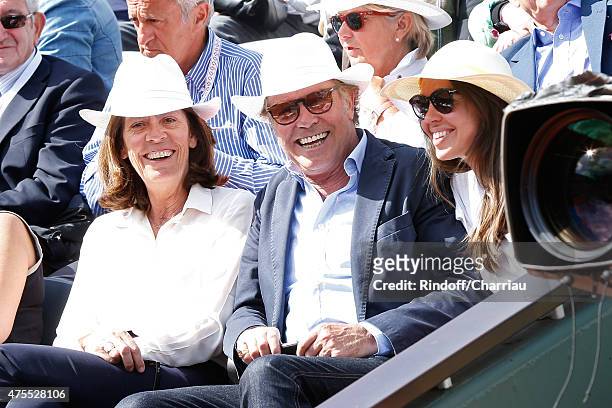 Humorist Michel Leeb sitting between his wife Beatrice and their daughter Elsa attend the 2015 Roland Garros French Tennis Open - Day Nine on June 1,...