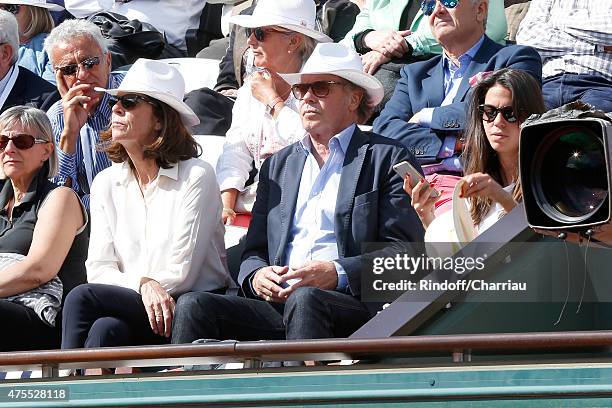 Humorist Michel Leeb sitting between his wife Beatrice and their daughter Elsa attend the 2015 Roland Garros French Tennis Open - Day Nine on June 1,...