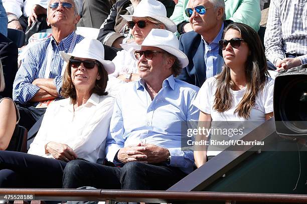 Humorist Michel Leeb sitting between his wife Beatrice and their daughter Elsa attend the 2015 Roland Garros French Tennis Open - Day Nine on June 1,...