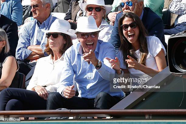 Humorist Michel Leeb sitting between his wife Beatrice and their daughter Elsa attend the 2015 Roland Garros French Tennis Open - Day Nine on June 1,...