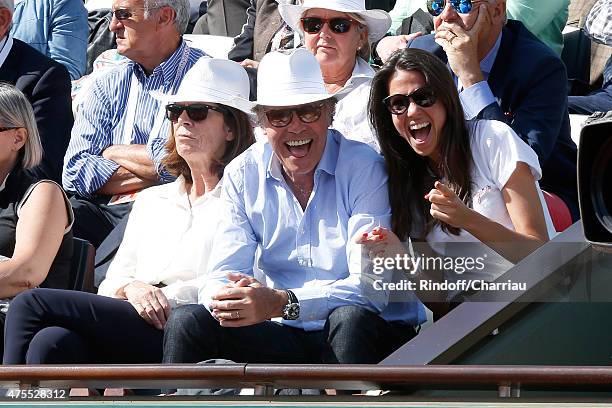 Humorist Michel Leeb sitting between his wife Beatrice and their daughter Elsa attend the 2015 Roland Garros French Tennis Open - Day Nine on June 1,...