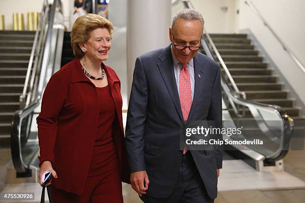 Sen. Debbie Stabenow and U.S. Sen. Charles Schumer talk before boarding the Senate Subway at the U.S. Capitol June 1, 2015 in Washington, DC. In...