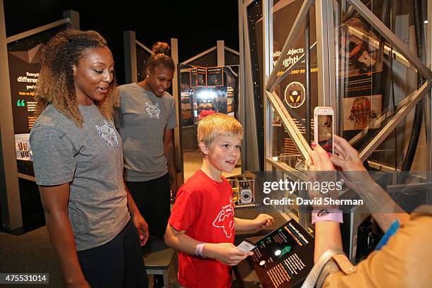 Monica Wright and Rebekkah Brunson of the Minnesota Lynx visit the Science Museum of Minnesota with Wishes & More Kids and their families on May 29,...