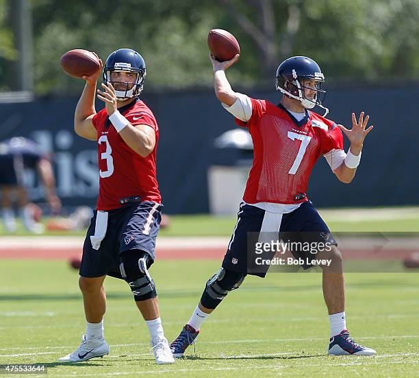 Tom Savage of the Houston Texans and Brian Hoyer work out during an NFL football organized team activity June 1, 2015 in Houston, Texas.