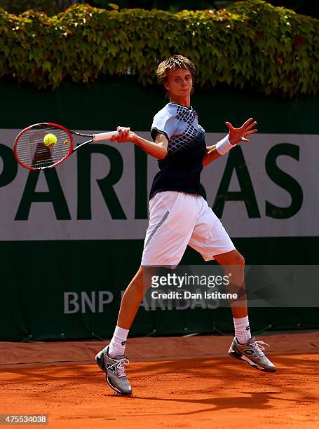 Alexander Bublik of Russia in action during his boys singles match against William Blumberg of the United States on day nine of the 2015 French Open...