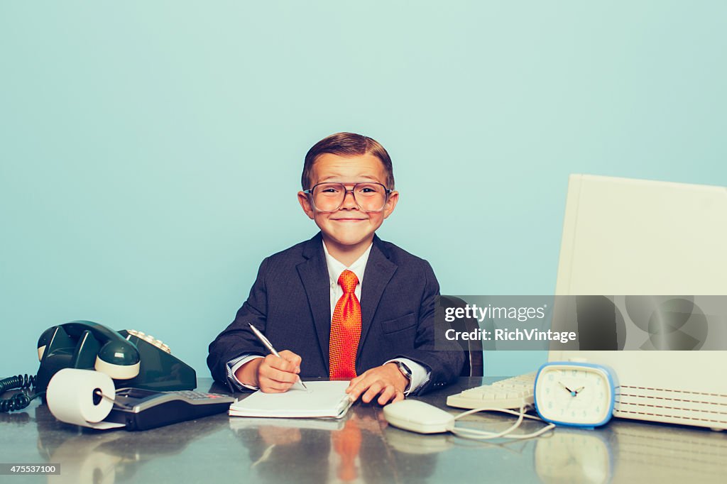 Young Boy Businessman Working at the Office