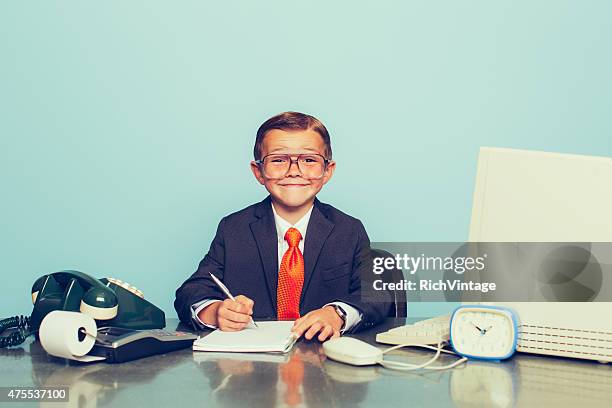 young boy businessman working at the office - resourceful stock pictures, royalty-free photos & images