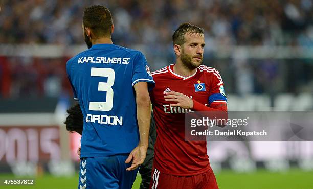 Daniel Gordon of Karlsruhe and Rafael van der Vaart of Hamburg react...  News Photo - Getty Images