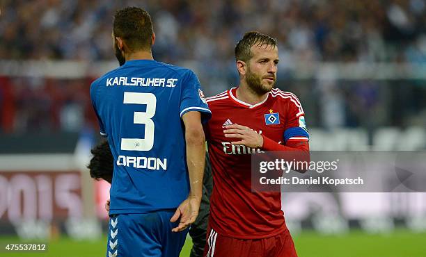 Daniel Gordon of Karlsruhe and Rafael van der Vaart of Hamburg react... News Photo - Getty Images
