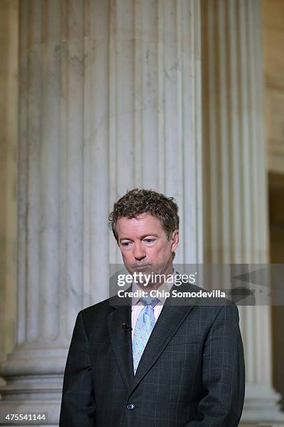 Sen. Rand Paul prepares to do a live interview with FOX News in the Russell Senate Office Building rotunda on Capitol Hill June 1, 2015 in...