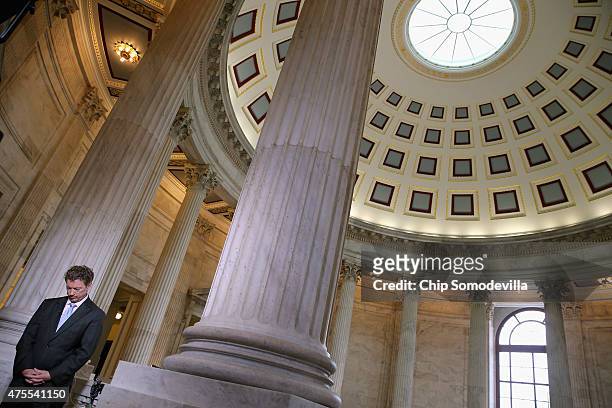 Sen. Rand Paul prepares to do a live interview with FOX News in the Russell Senate Office Building rotunda on Capitol Hill June 1, 2015 in...