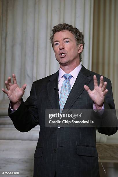 Sen. Rand Paul does a live interview with FOX News in the Russell Senate Office Building rotunda on Capitol Hill June 1, 2015 in Washington, DC. In...