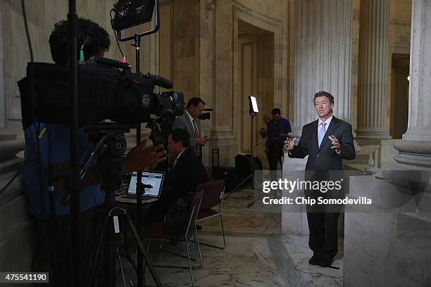 Sen. Rand Paul does a live interview with FOX News in the Russell Senate Office Building rotunda on Capitol Hill June 1, 2015 in Washington, DC. In...