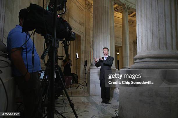 Sen. Rand Paul does a live interview with FOX News in the Russell Senate Office Building rotunda on Capitol Hill June 1, 2015 in Washington, DC. In...