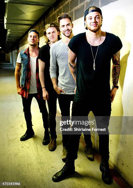 Andy Brown, Ryan Fletcher, Joel Peat and Adam Pitts of Lawson pose backstage after performing and signing copies of their album 'Roads' at HMV...