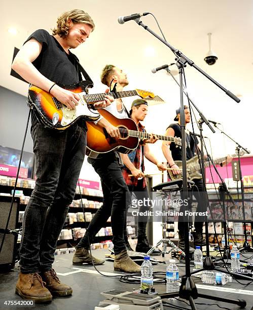Andy Brown, Ryan Fletcher, Joel Peat and Adam Pitts of Lawson perform and sign copies of their album 'Roads' at HMV Manchester on June 1, 2015 in...