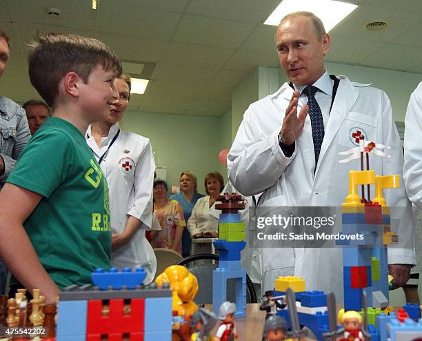 Russian President Vladimir Putin visits the Research and Scientific Institute for Children Surgery and Traumatology June 1, 2015 in Moscow, Russia....