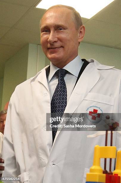 Russian President Vladimir Putin visits the Research and Scientific Institute for Children Surgery and Traumatology June 1, 2015 in Moscow, Russia....