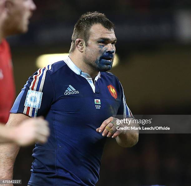 French prop Nicolas Mas has blue paint on his face from the pitch publicity during the RBS Six Nations match between Wales and France at the...