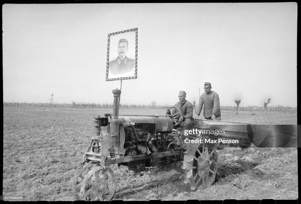 Tractor Operators In A Field