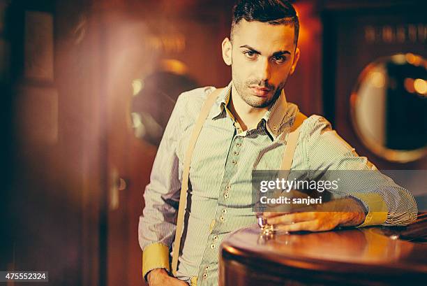 young man drinking at the nightclub - speakeasy stock pictures, royalty-free photos & images