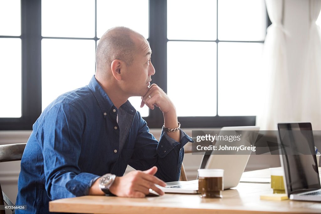 Japanese Man Using Computer Japanese Man At Work On Laptop Computer High-Res Stock Photo - Getty Images