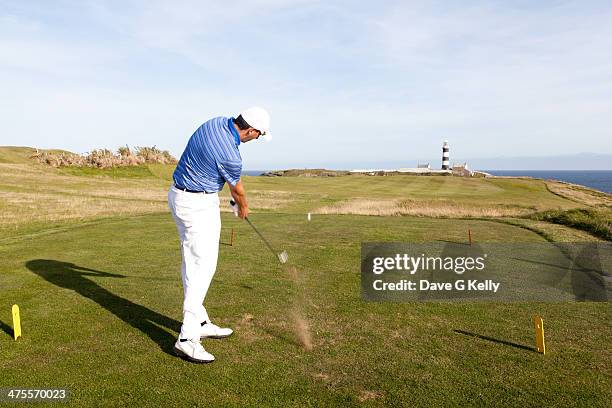 golfer driving off tee box - ティーグラウンド ストックフォトと画像