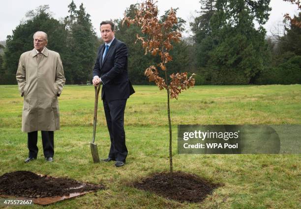 Prince Philip, Duke of Edinburgh and Prime Minister David Cameron plant an oak tree in the grounds of Chequers where they had lunch with the Queen...